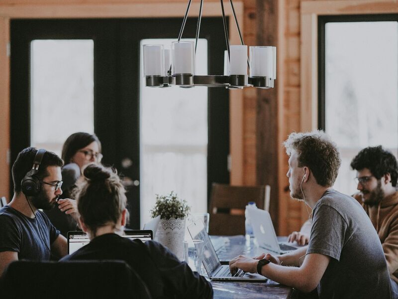 Friendly telecom professionals collaborating in a bright office